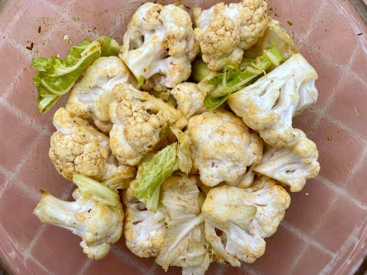 Cauliflower coated in curry powder and olive oil.