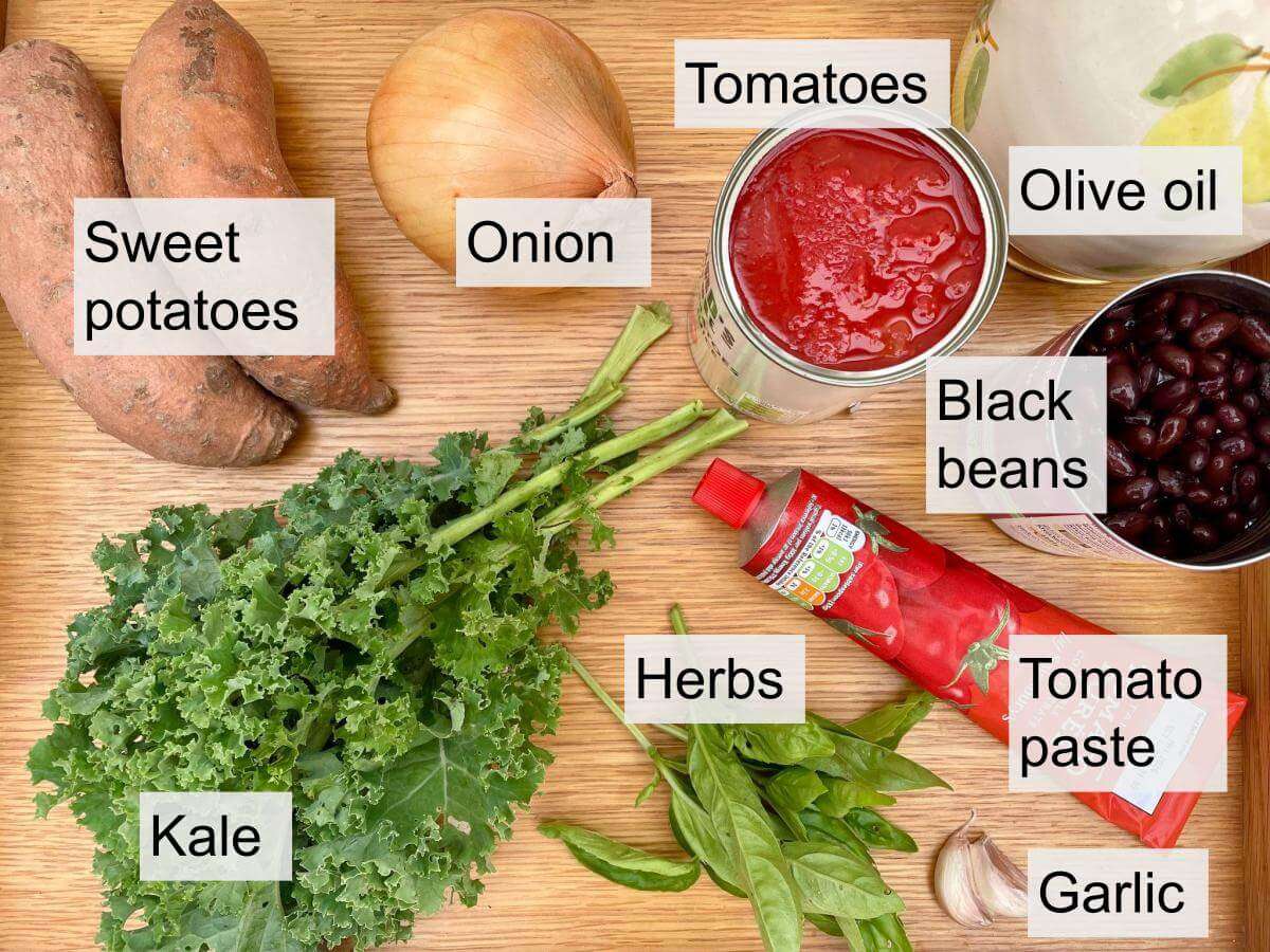 Sweet potatoes, onion, can tomatoes, olive oil, black beans, tomato paste, garlic, herbs, kale.