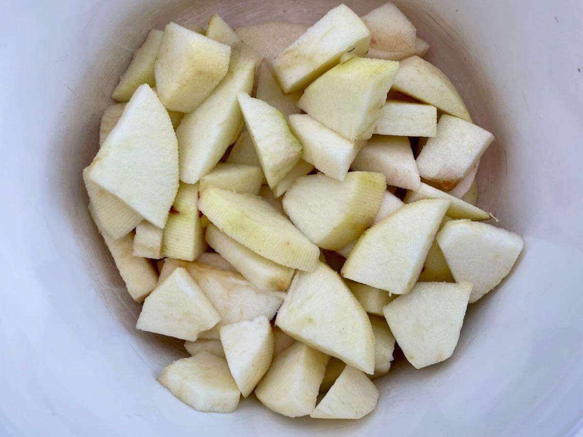 Sliced apples in pan.