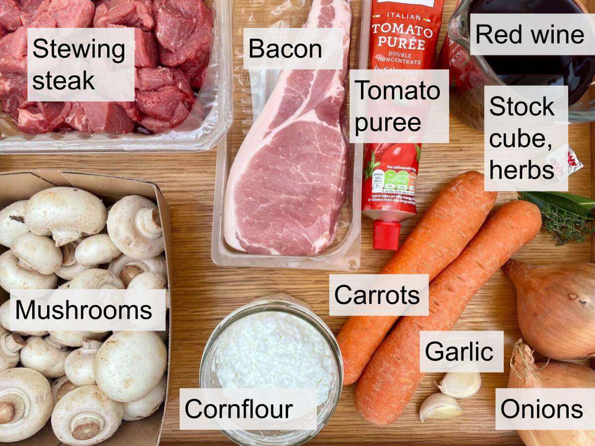 Stewing steak, bacon, tomato puree, red wine, stock cube, herbs, onions, garlic, carrots, mushrooms, cornflour.
