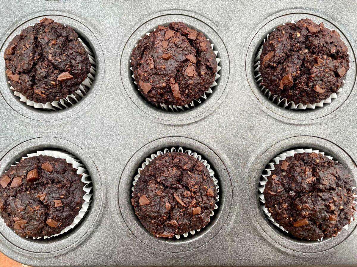 Cooked healthy chocolate muffins in tin.