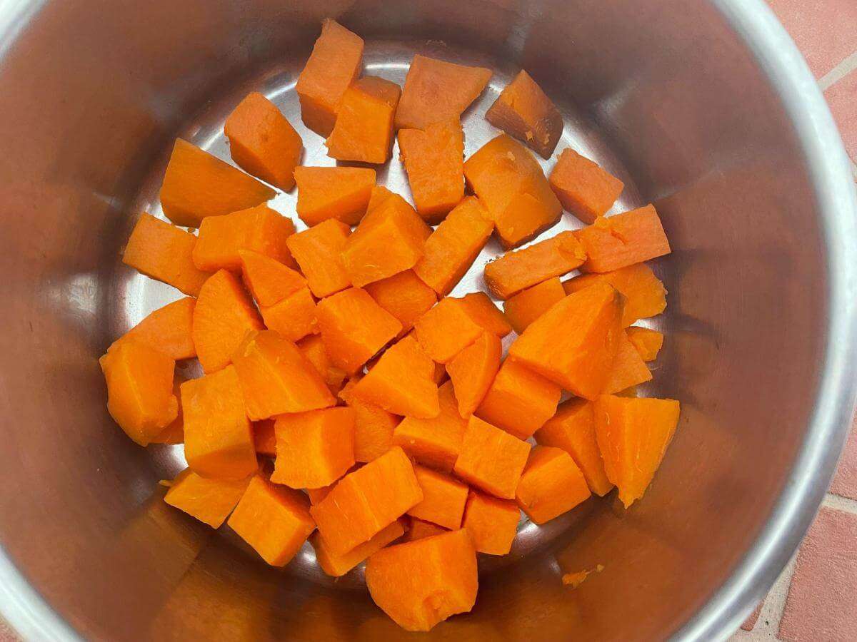 Cubes of sweet potato in pan.