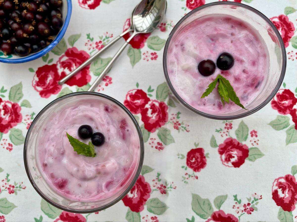 Blackcurrant fool in glass serving dish.