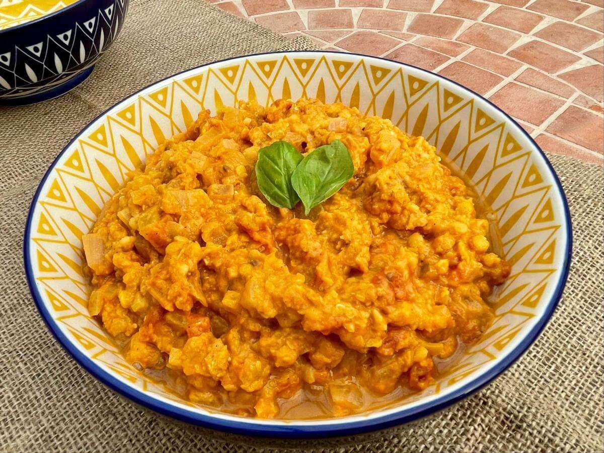 Red lentil dhal in colourful bowl.