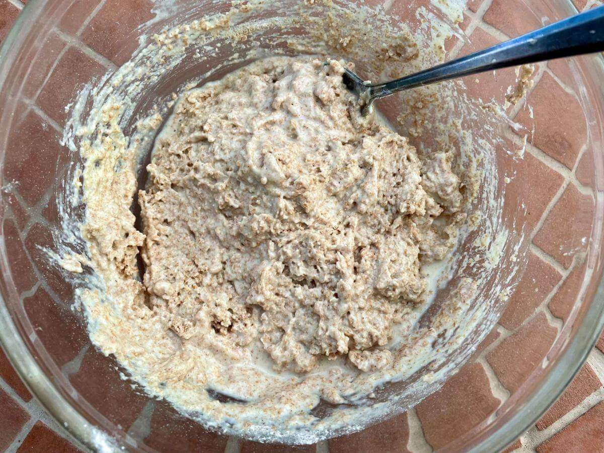 Mixing spelt flour into yogurt and egg.