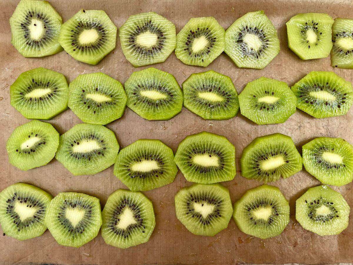Kiwi fruit slices on baking tray.
