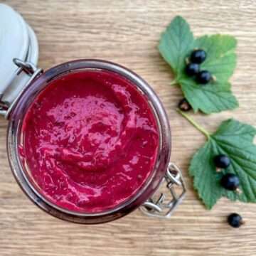 Blackcurrant curd in jar.