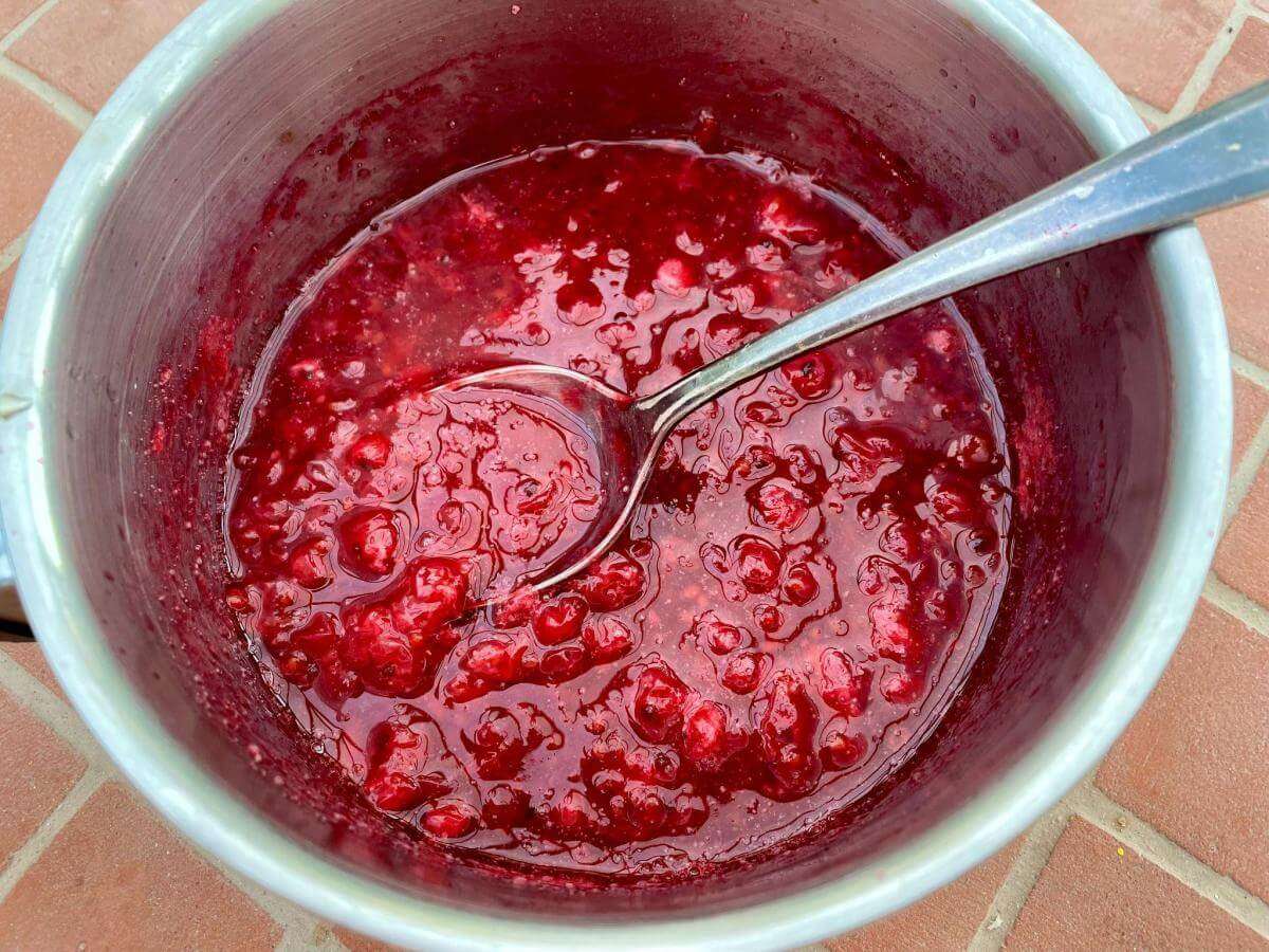 Fruit coulis cooking in pan.