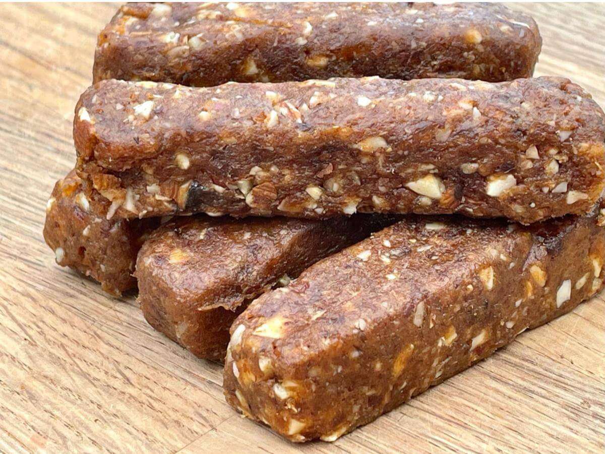 Stack of raw fruit and nut bars.