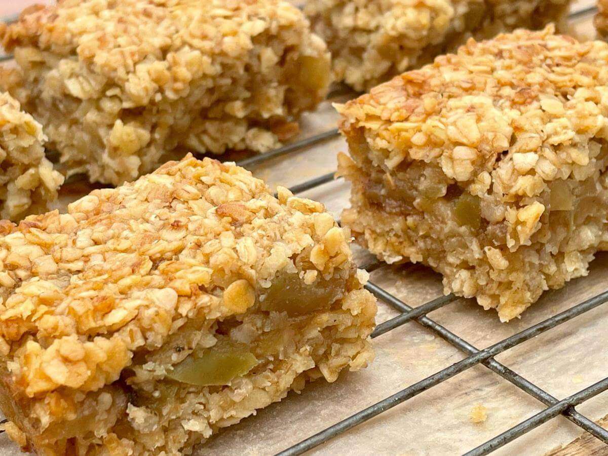 Healthy apple crumble slices on wire rack.