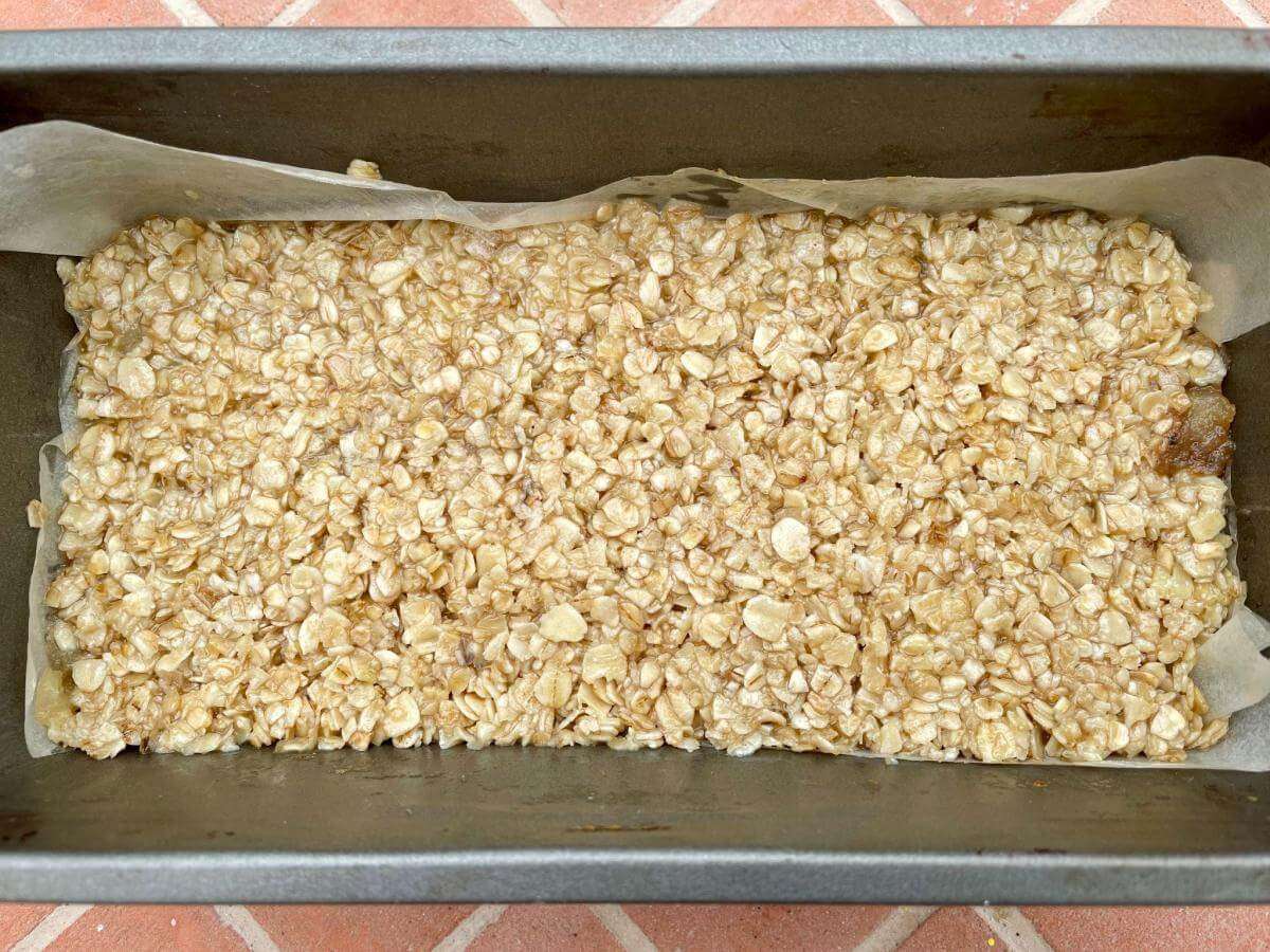 Oat and apple mixture in loaf tin.
